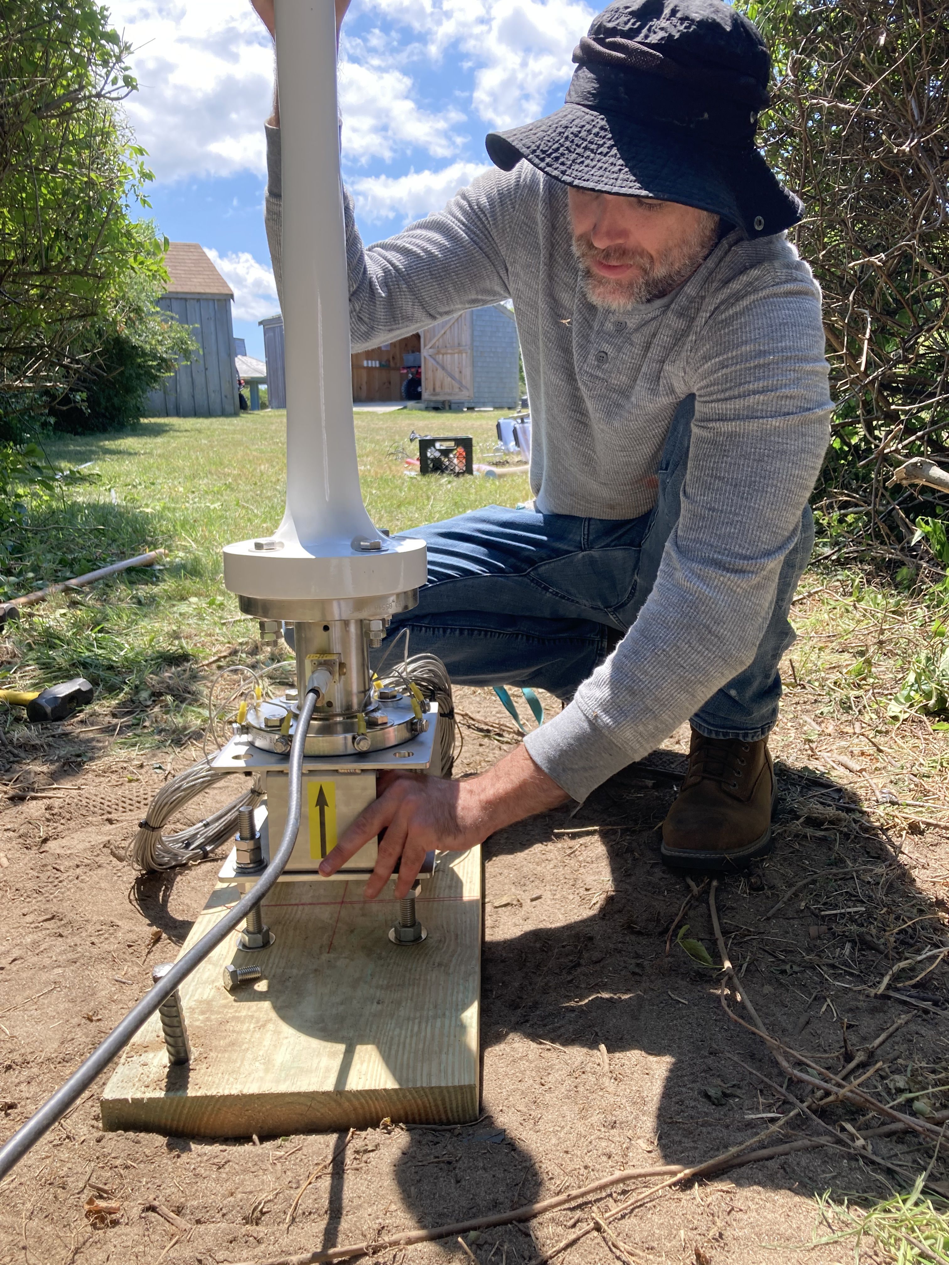 Patrick Pasteris works to install one of the two HF radar antennas at the Nauset (NAUS) site in Eastham, MA.